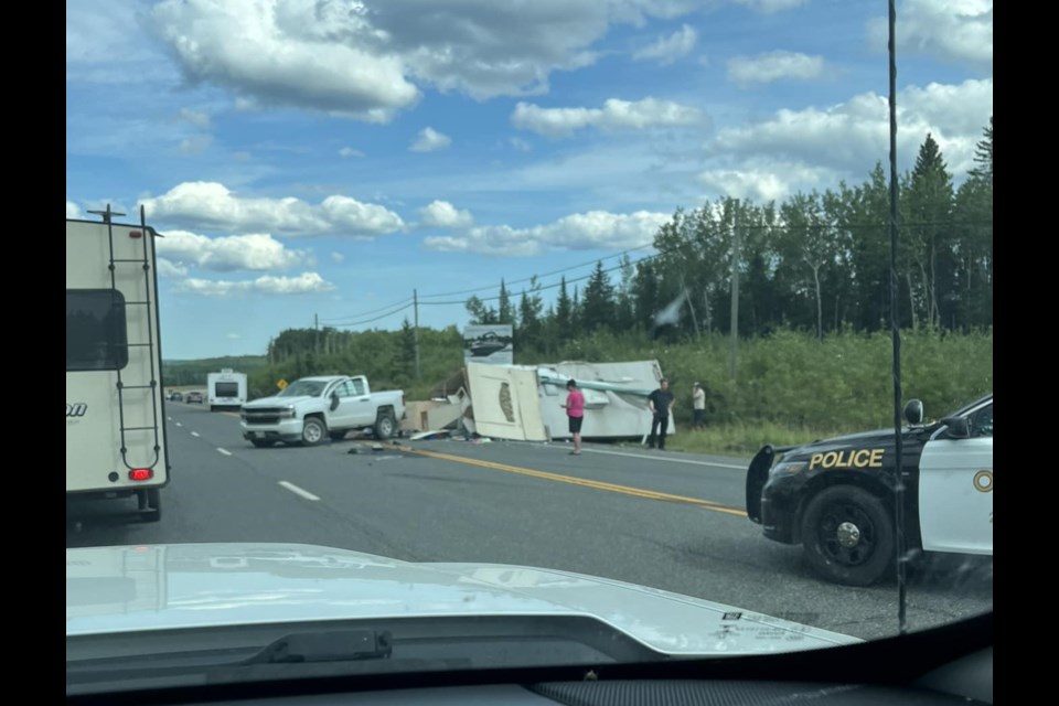 An RV being towed by a pickup truck was demolished Tuesday on Highway 11/17 east of Shabaqua Corners (NWORoads.ca/Facebook)