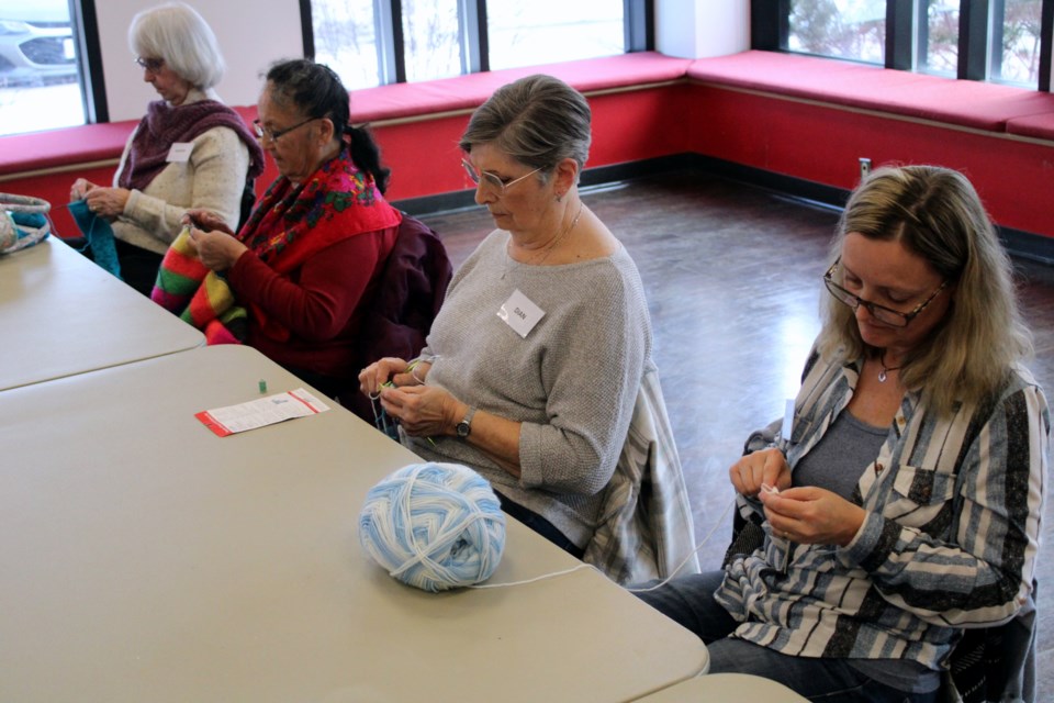 Members of Wit Knits work on various projects at the Mary J.L. Black Library on Feb. 8.
