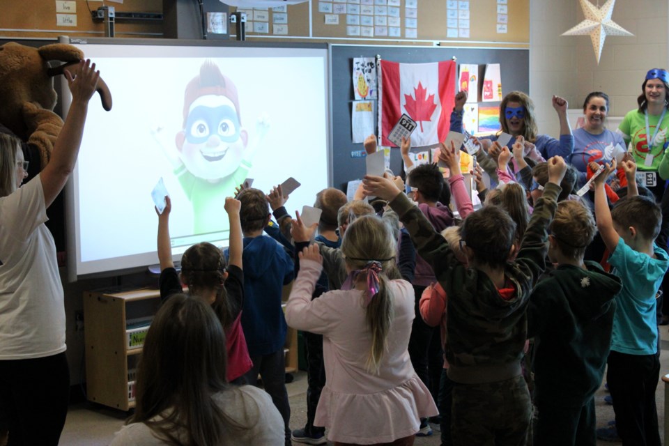 Students in Janine Andraka's Grade 1 class at Woodcrest Public School perform a song as part of the FAST Heroes program, which teaches kids about the signs of a stroke.