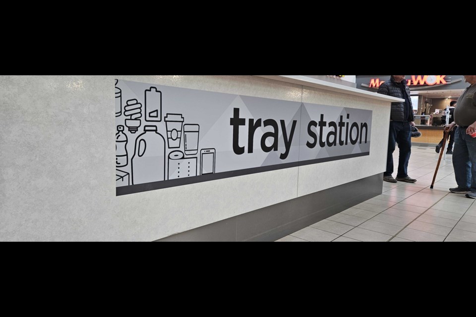 The central tray station is where food court patrons can drop off their trays and food waste to be sorted. 