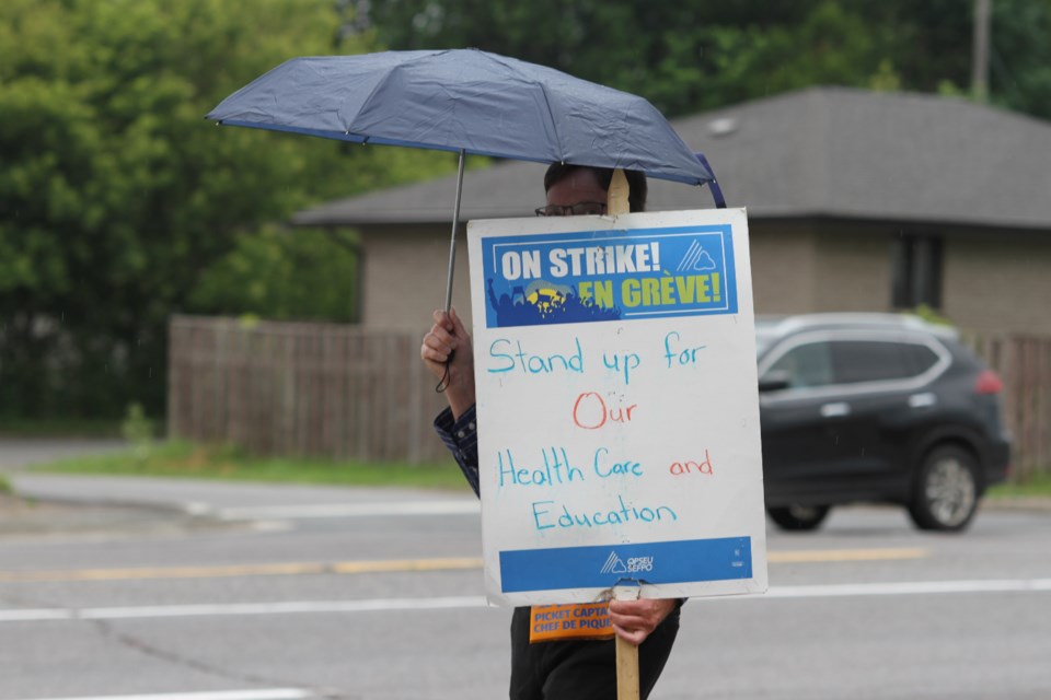 LCBO employees and supports walk the picket line at the Arthur St location on July 15, 2024. 