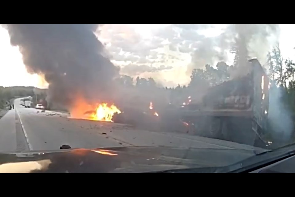 A transport truck caught fire after hitting a rock cut on Highway 17 east of Dryden on June 15, 2024 (OPP/Facebook)