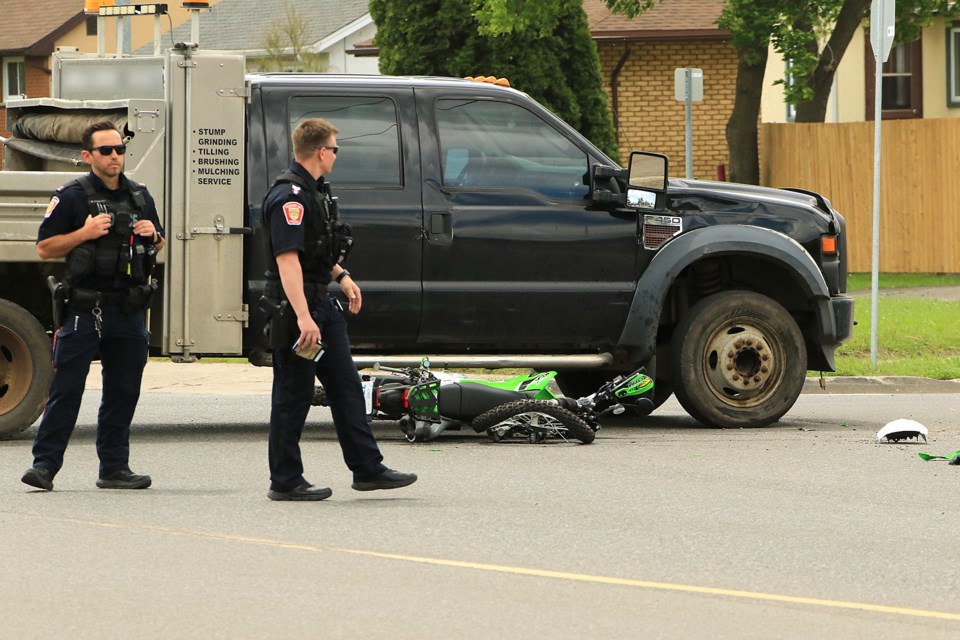 Thunder Bay Police are on scene on Thursday, June 13, 2024 at the intersection of Gore and James steets after a collision involving a truck and a motorcycle. (Leith Dunick, tbnewswatch.com)