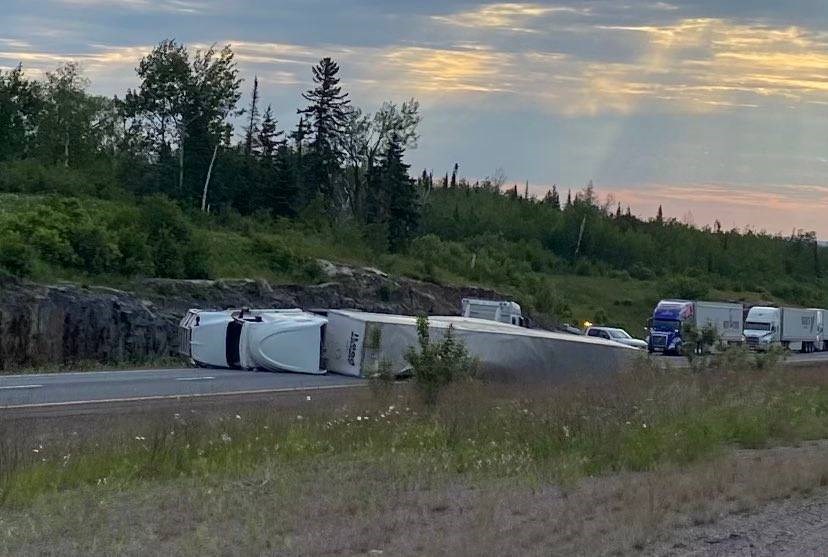 A truck driver was charged with careless driving after a tractor-trailer overturned on Highway 11/17 in Shuniah on June 23, 2024 (Skilled Truckers Canada/Facebook)