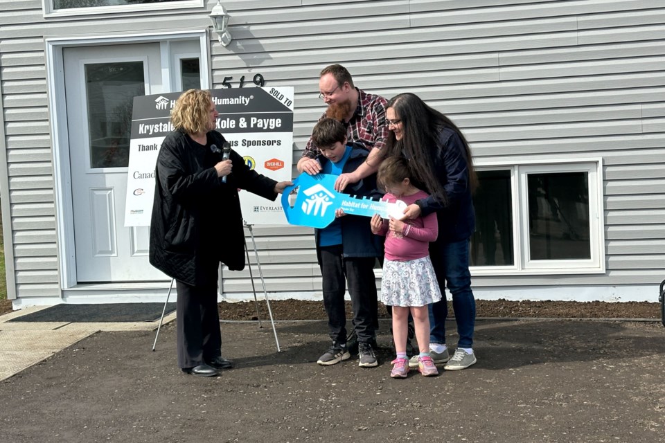 The Slater family receives the keys to their new home