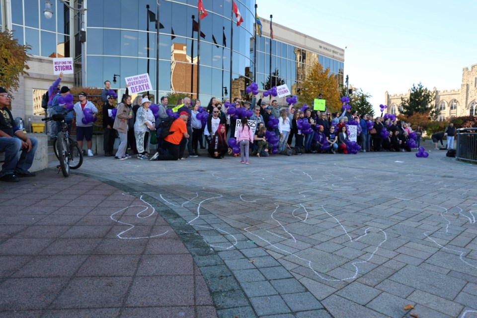 Die-in organized at city hall on Oct. 21 to protest the closure of the Path 525 safe consumption site next March.