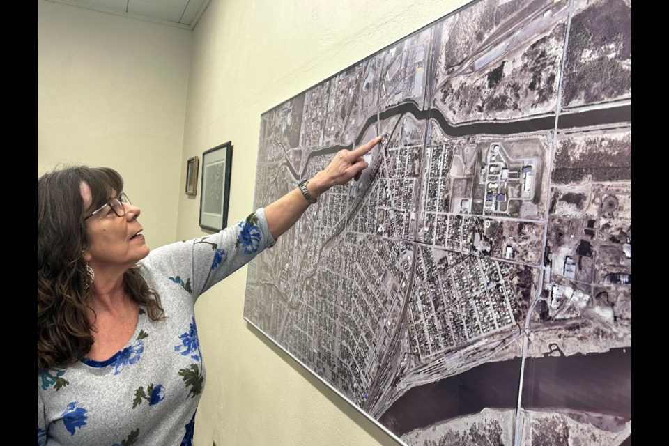 Donna Blunt, chair of the LRCA board of directors, points to the parcel of land owned by the LRCA, which has been has been identified as a potential site for the temporary shelter village by the city. 