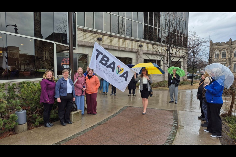 About 10 people gathered for the volunteer week flag raising on April 28 at city hall