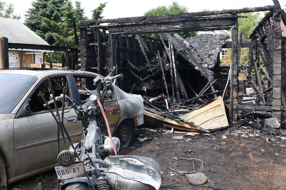 A fire on Monday, Aug. 4, 2025 completely destroyed a garage in the 300 block of West Amelia Street. (Penny Robinson, tbnewswatch.com)