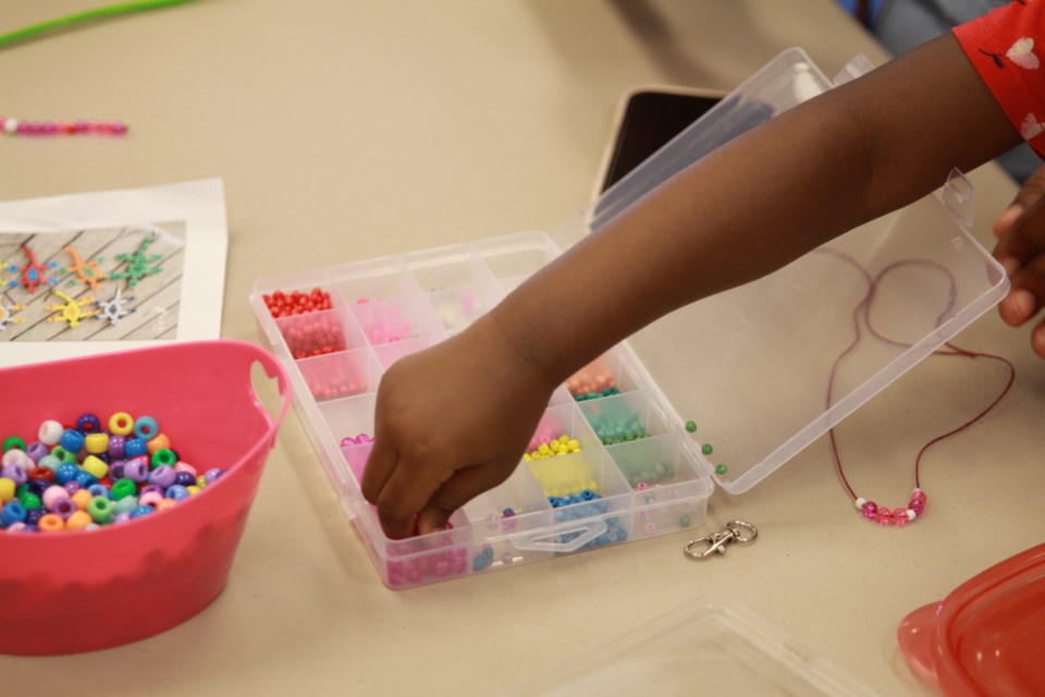 Community members at the County Park Library blissful beading event on JAugust 7, 2025.