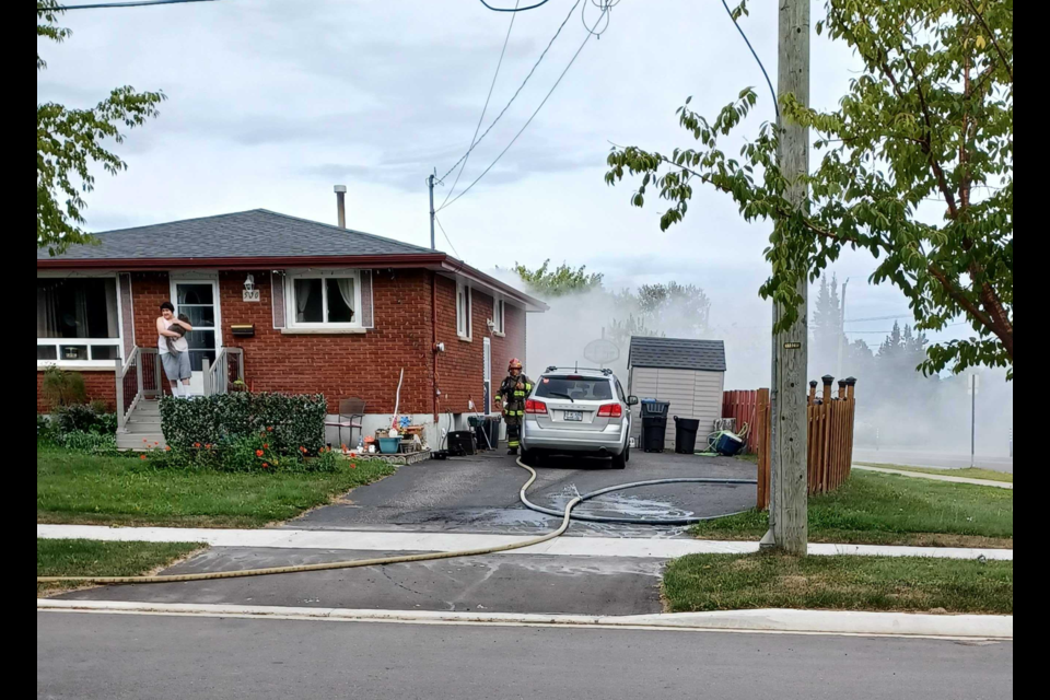 Firefighters attempt to extinguish a Current Avenue home fire on Sunday, Aug. 24, 2025. 