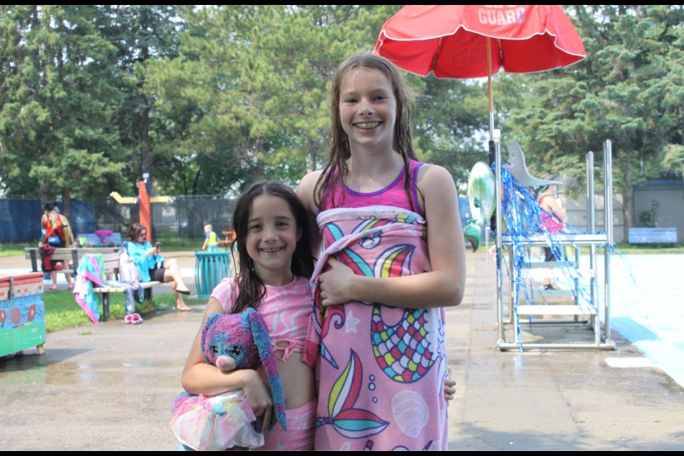 Abigail Carr, right, and her sister enjoying Festival Day at Art Widnall Pool on Aug. 12, 2025.