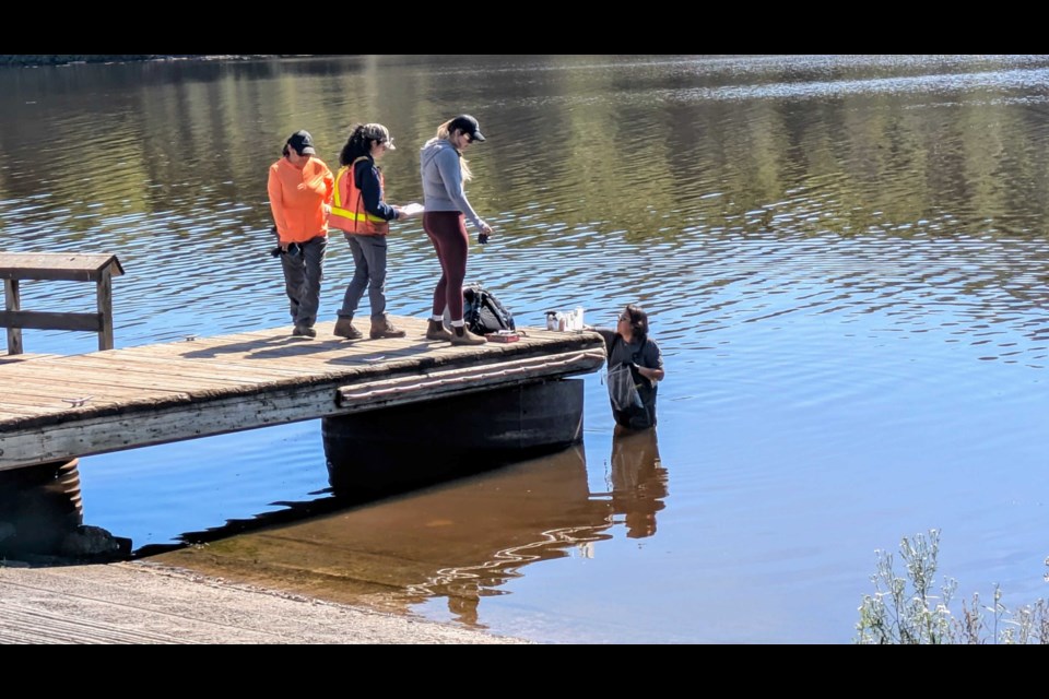 The Fort William First Nation environmental team is taking samples from the Kam River on Aug 28, 2025 after a reported hazardous spill 