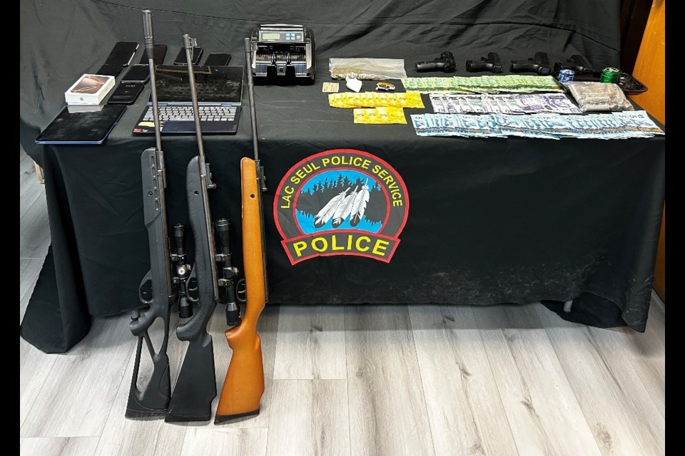 Lac Seul Police Service seized drugs, replica handguns, rifles, cash, and other items that are consistent with drug trafficking.