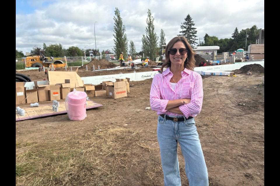 Cherie Papa, managing partner of Lux Suites, on site of the new build on Aug. 14, 2025