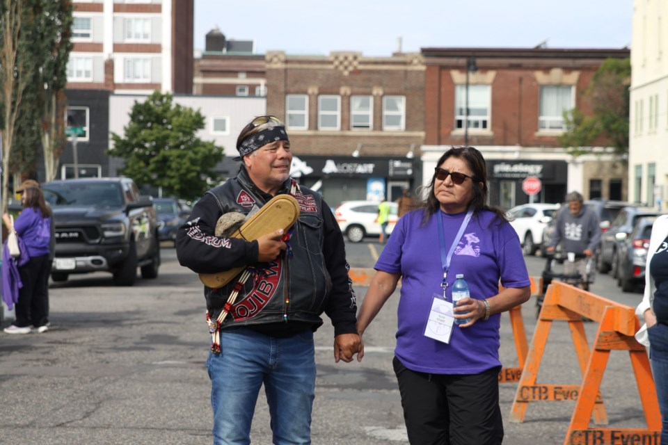 A club member from the Redrum motorcycle group and Anna Betty Achneepineskum, deputy grand chief of Nishnawbe Aski Nation, at the International Overdose Awareness Day held by the Thunder Bay Drug Strategy and Thunder Bay District Health Unit outside of Shelter House on Aug. 27, 2025.
