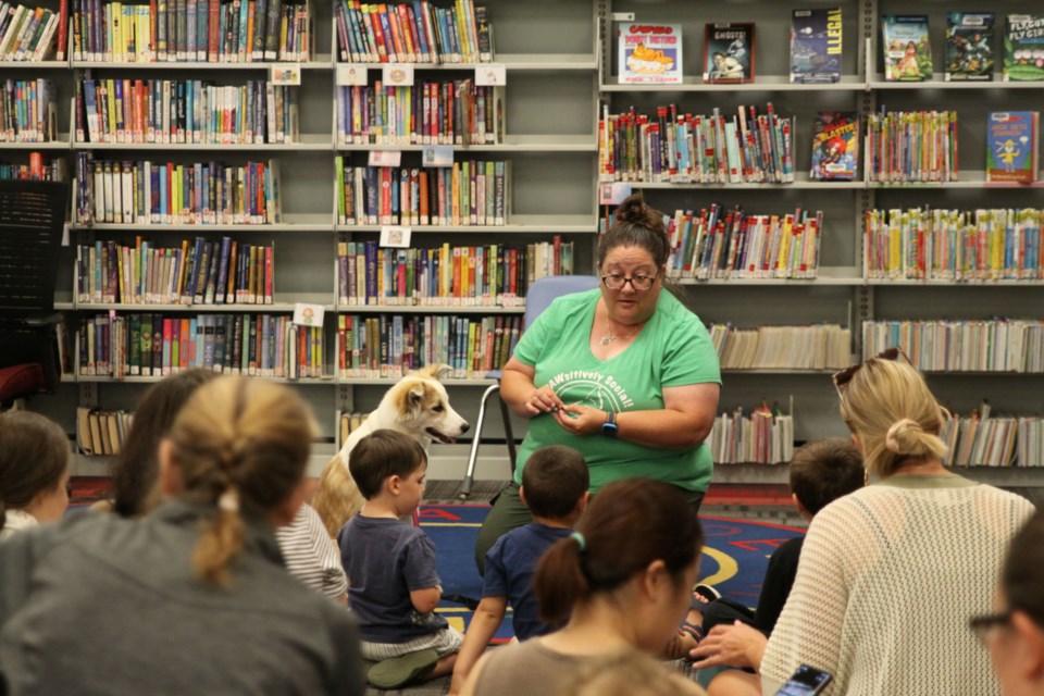 Piper the dog and Tammy from PAWsitively Social at the County Park library for the Puppy Perks program on August 12, 2025.