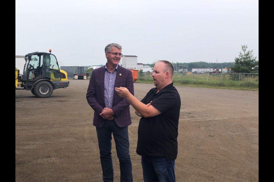 Jason Cook, Recycle West's regional manager and part owner speaks with Thunder Bay-Atikokan MPP Kevin Holland.