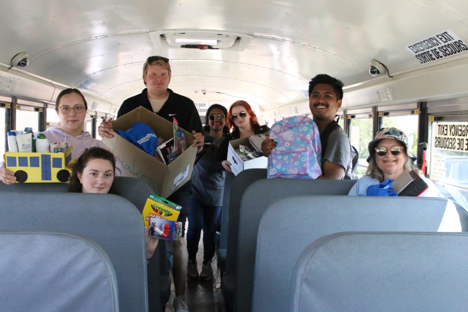 The United Way of Thunder Bay’s GenNext tallies up school supply totals for their Stuff-A-Bus campaign at the Dennis Franklin Cromarty (DFC) High School on Aug. 30.
