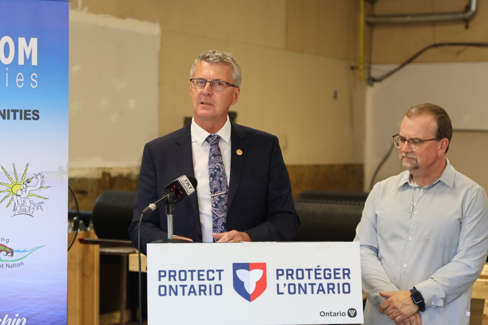 MPP Kevin Holland and Norm Jaehrling, Chairperson of Supercom’s Board of Directors