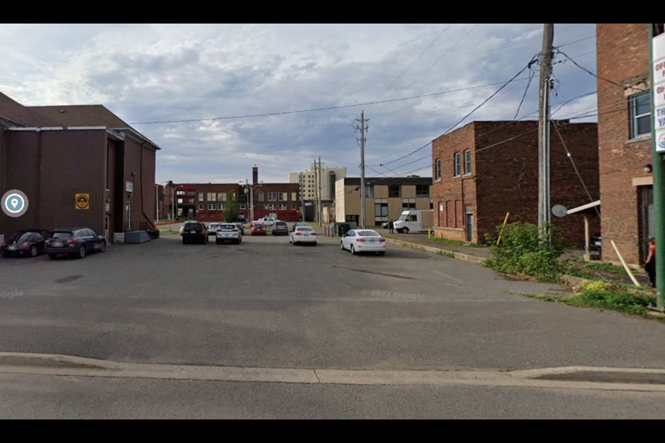 This parking lot at 212 Miles Street East will be the site of a 16-unit tiny home village managed by Alpha Court (Google Street View)
