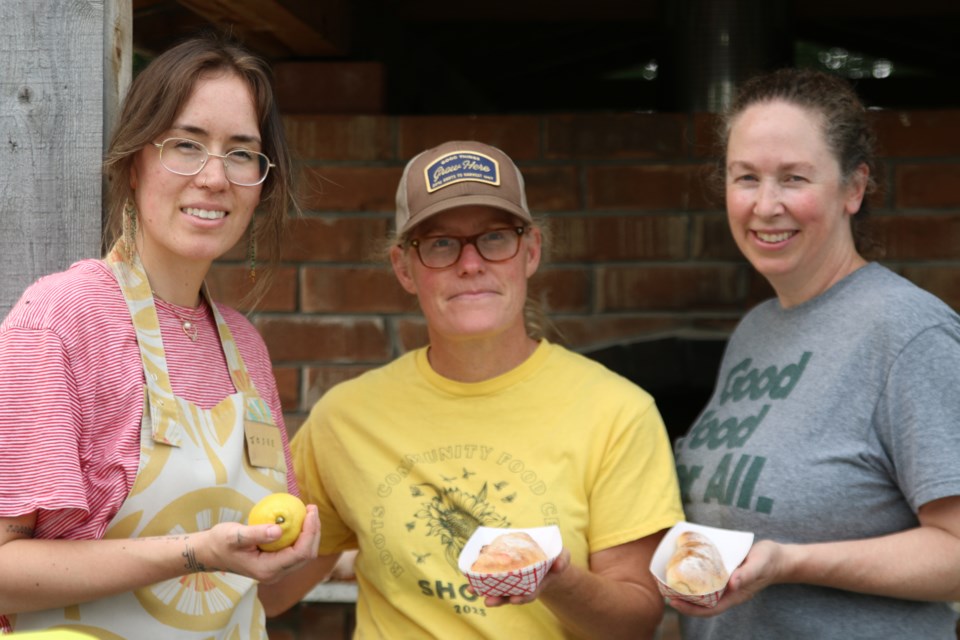 Erin Beagle, the Roots Community Food Centre’s executive director, centre, joins Josee Dyer, left, and Mary Debakker, right, to bake handmade pies. Coming together, Beagle says, allows folks to support one event and three great organizations.