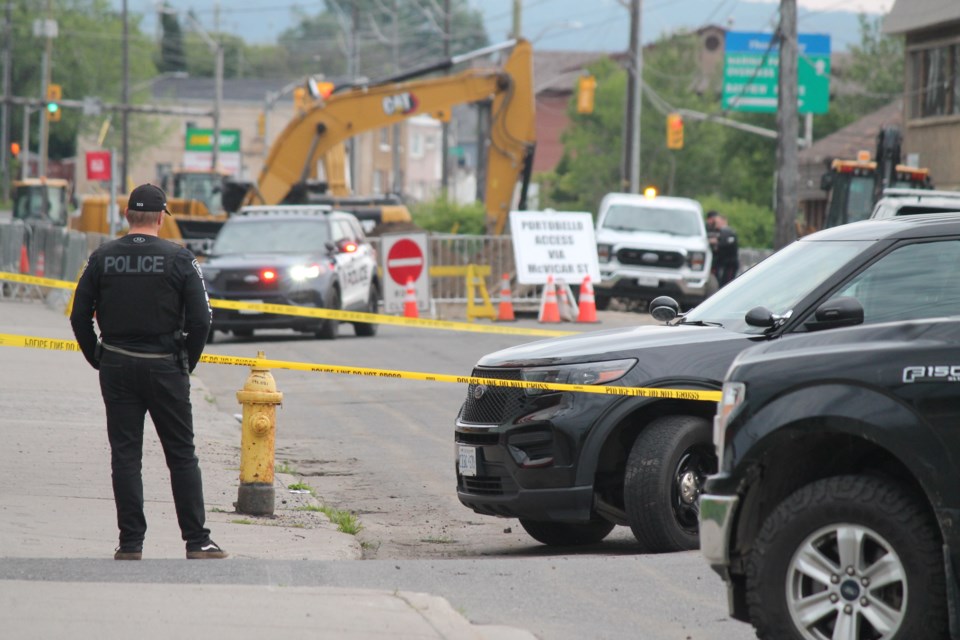 Police officers had to contain a scene on the 100 block of Cumberland Street North on July 4, 2025. 