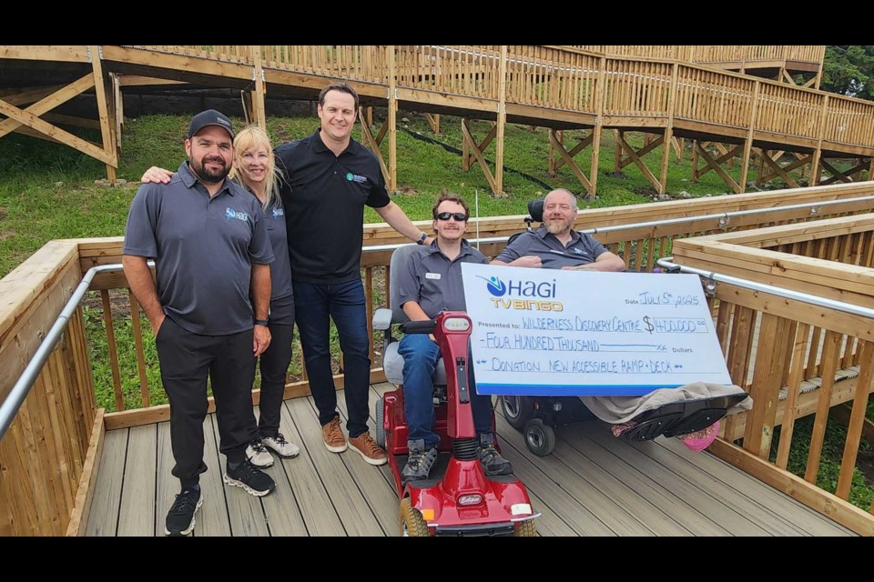 HAGI representatives present a $400,000 cheque on July 5, 2025 to the Wilderness Discovery Centre for a new accessible ramp and deck.