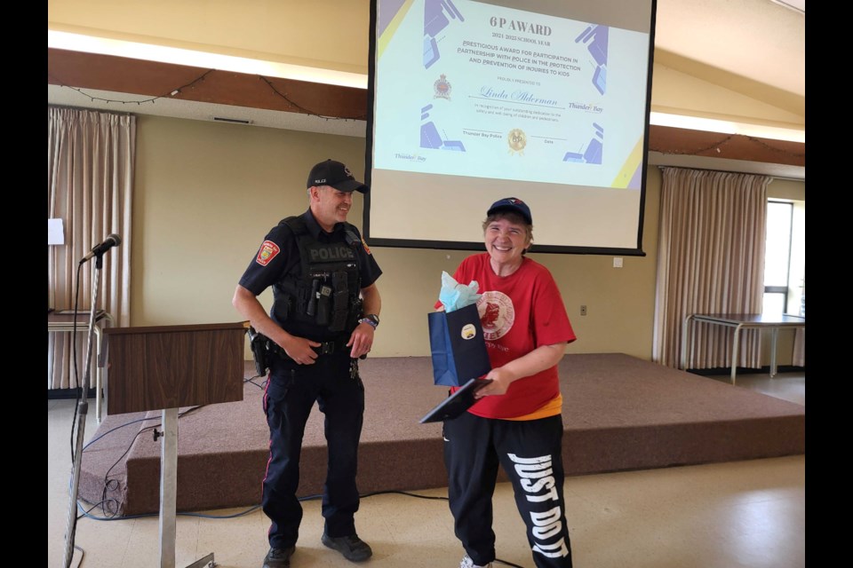 Constable Tom Armstrong presents Linda Algerman with the 6P award on June 4, 2025.