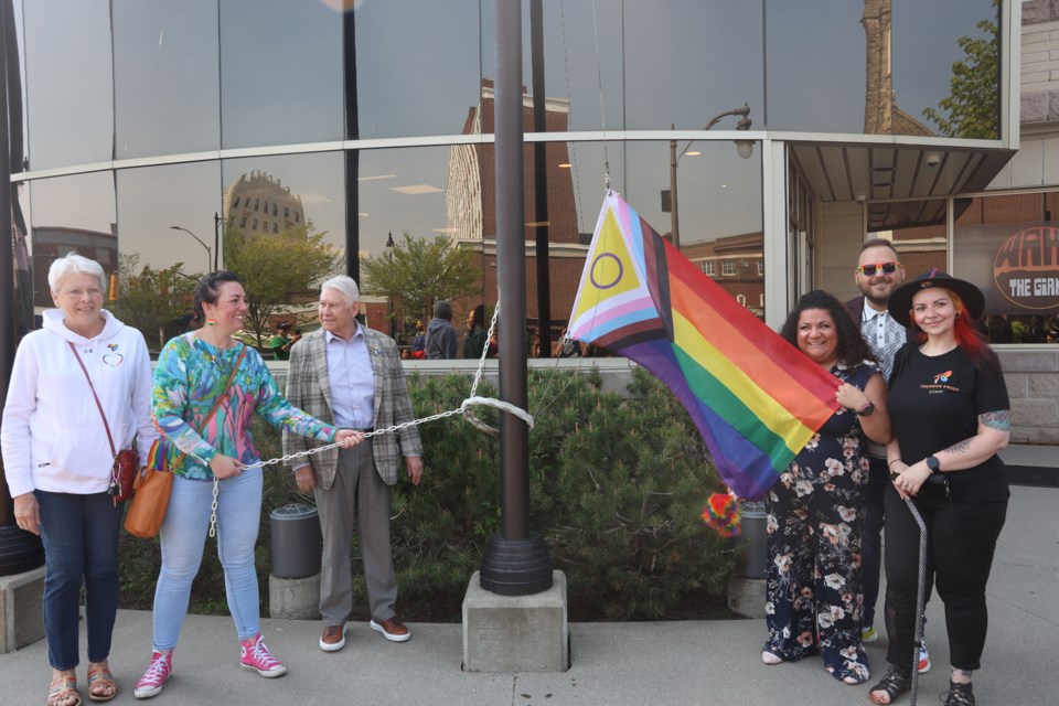 Dignitaries prepare to raise one of two Pride flags at Thunder Bay city hall on June 4, 2025.