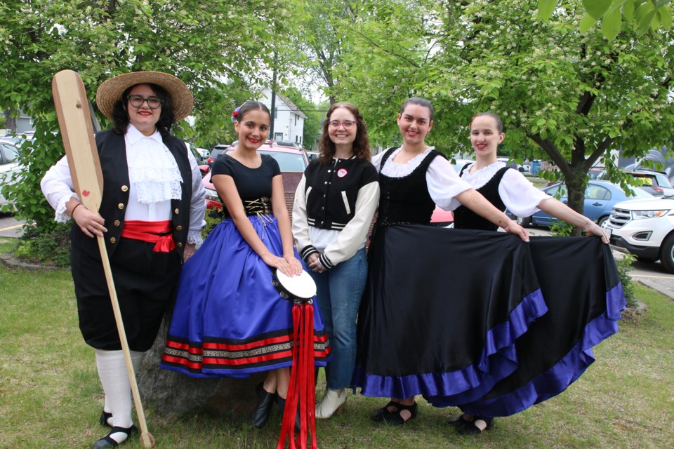 Le Stelle Alpine Italian Dancers Cris Carina, Dalia Papa, Evangeline Sawshuk and Graziella Aegard stand alongside the group's president, Beth DeProphetis, in the middle, outside before their performances.