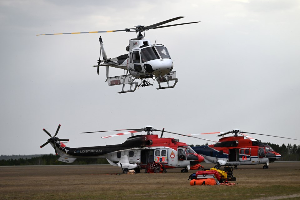 Seven helicopters have been assigned to the Kenora 14 fire, including two heavy-lift helicopters with extra bucket capacity (Chris Marchand/MNR photo)