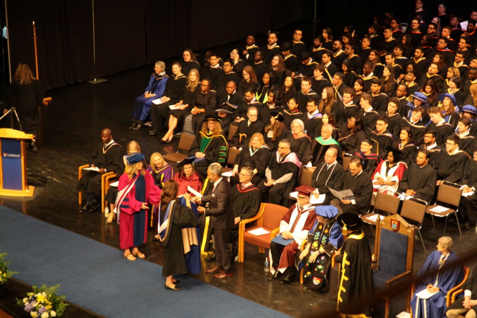  Jean Paul Gladu, wearing the black suit receiving his Honorary degree at Lakehead University's convocation on May 29, 2025.