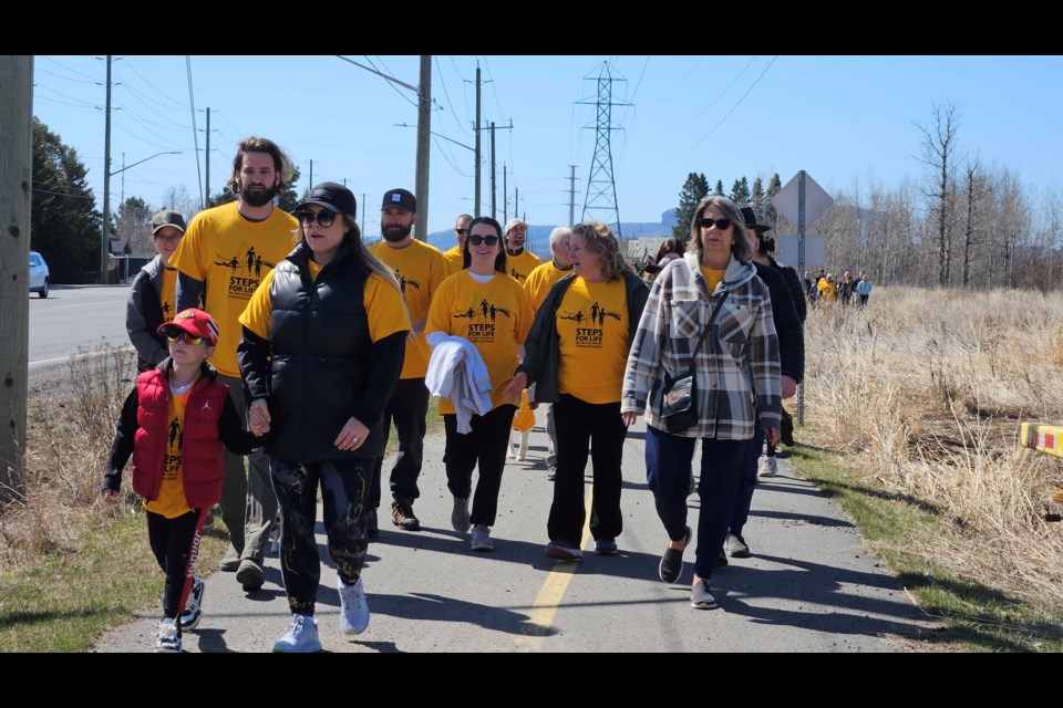 Nearly 100 people join Threads of Life for its annual Steps for Life walk on May 4.