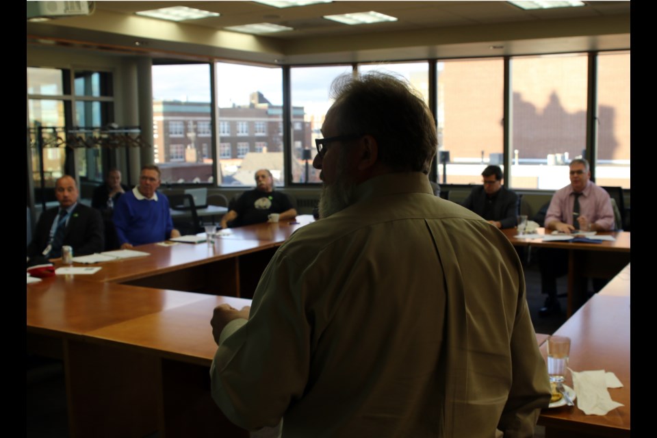 City clerk John Hannam (centre) speaks to council regarding changes to the Municipal Elections Act.