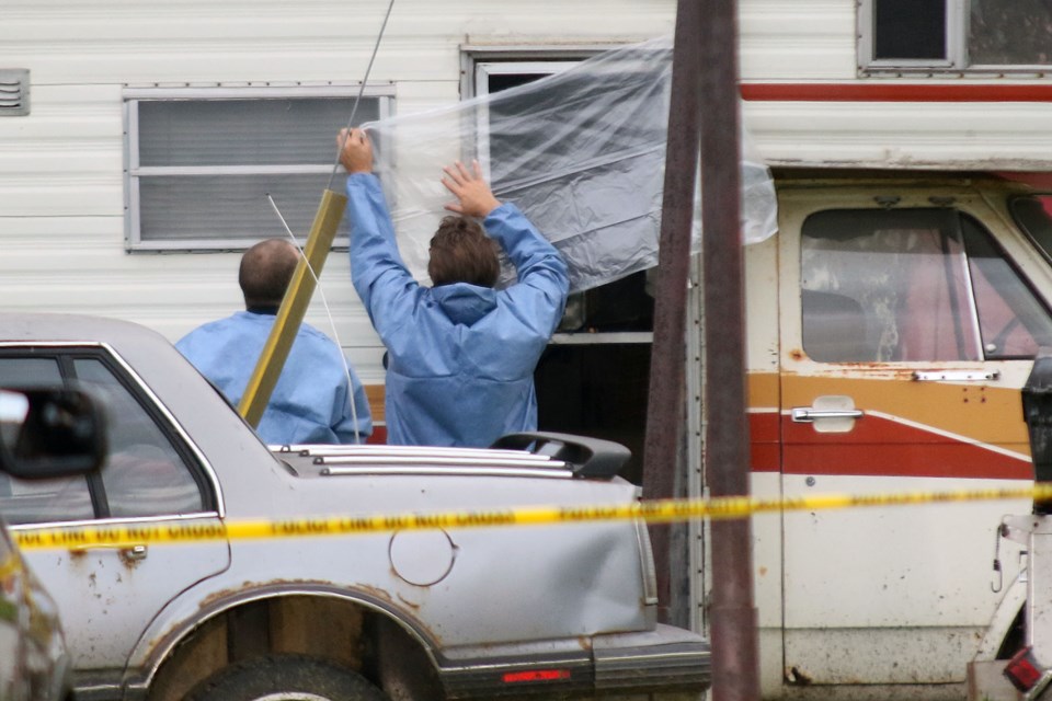 Investigators tape up a camper at a compound near Court Street South in Thunder Bay on Thursday, Sept. 15, 2016 after a body was found. 