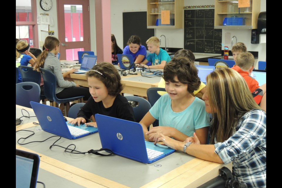           Nor'Wester View Public School students learn to code after the code:mobile arrives at their school Friday. (photo supplied)