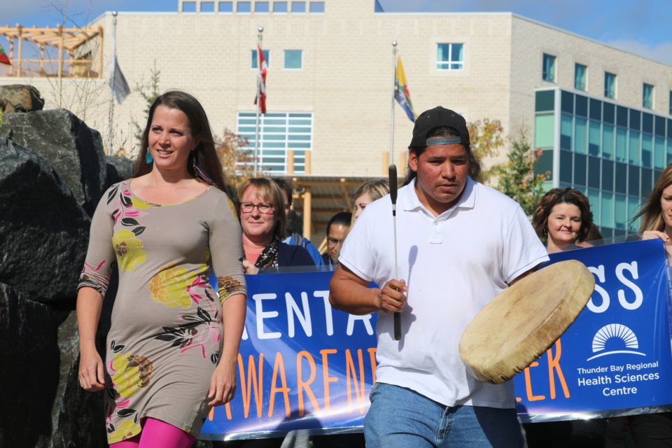 Wilhelmina Hodder, who has been diagnosed with bi-polar disorder, leads the Mental Health Awareness Walk at the Thunder Bay Regional Health Sciences Centre on Monday. 