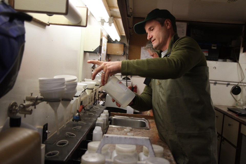 Fisheries and Oceans Canada aquatic science technician Jerome Keen treats the Kaministiquia River to reduce sea lamprey population.