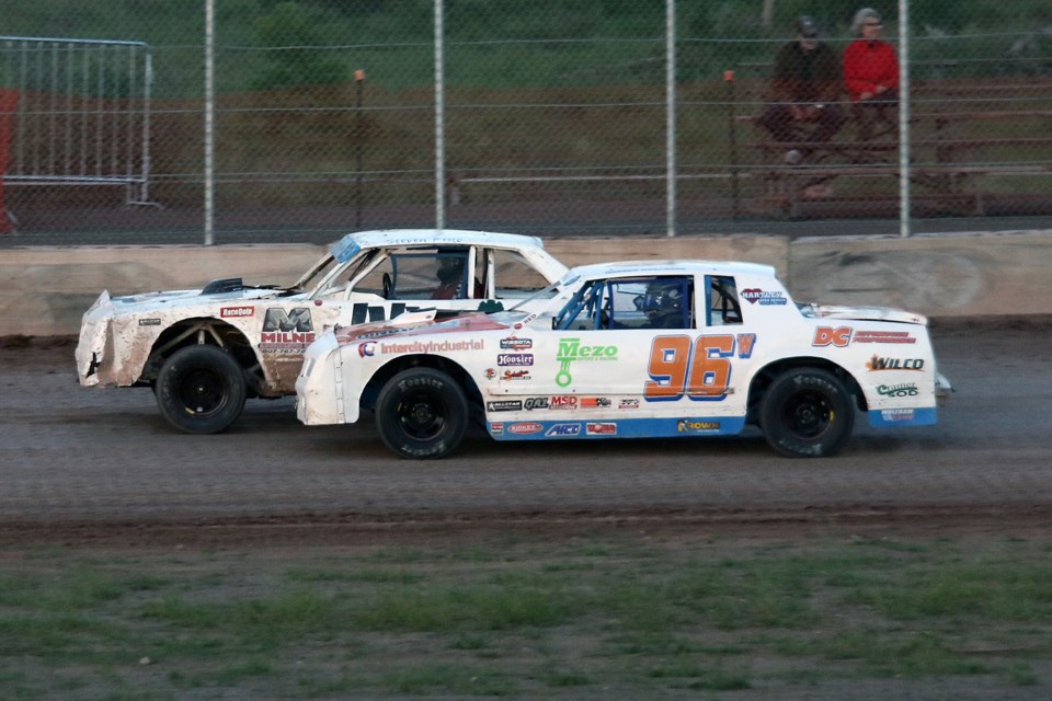 Darren Wolframe (96) overtakes Steve Pillo on Wednesday, July 6, 2022 in the Street Stock feature at the Thunder Bay Speedway. (Leith Dunick, tbnewswatch.com)