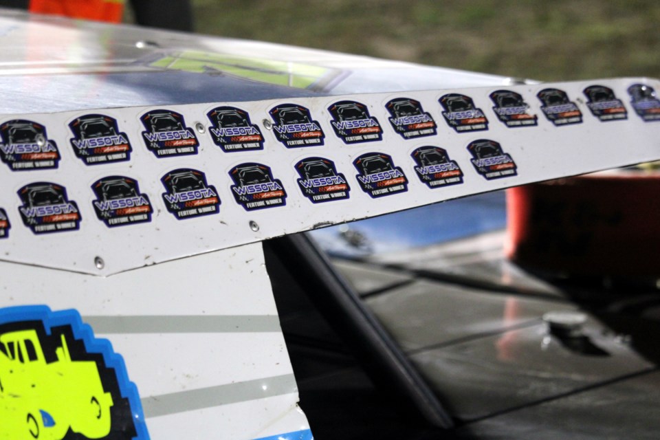 A bevy of feature win stickers decorates David Simpson's #70 WISSOTA Midwest Modified.