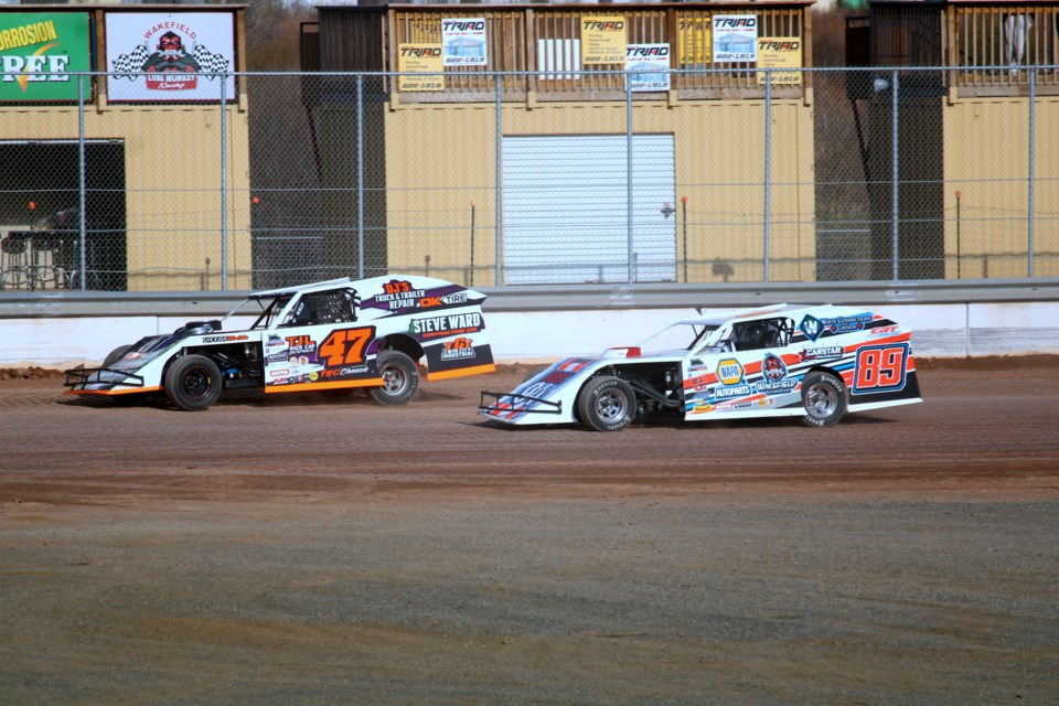 Don Craig (#47) and Kolby Reed (#89) race down the backstretch during the open practice session at the Thunder City Speedway on May 15.