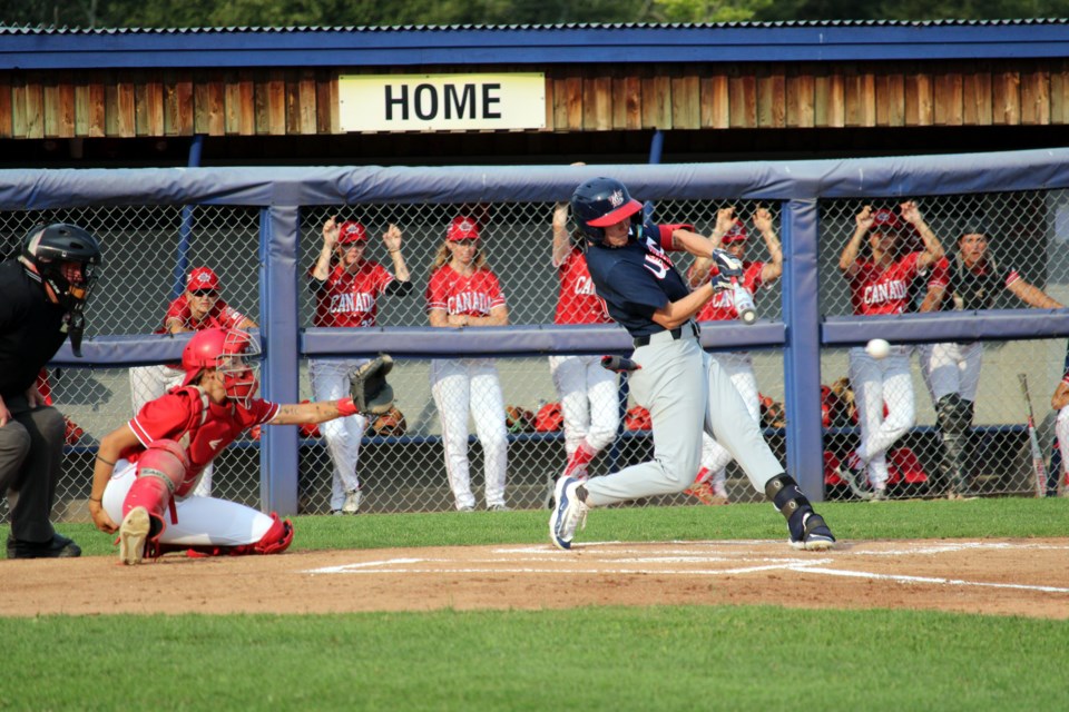 Ashton Lansdell makes a hit for the United States during an exhibition game against Canada at Baseball Central on July 26.