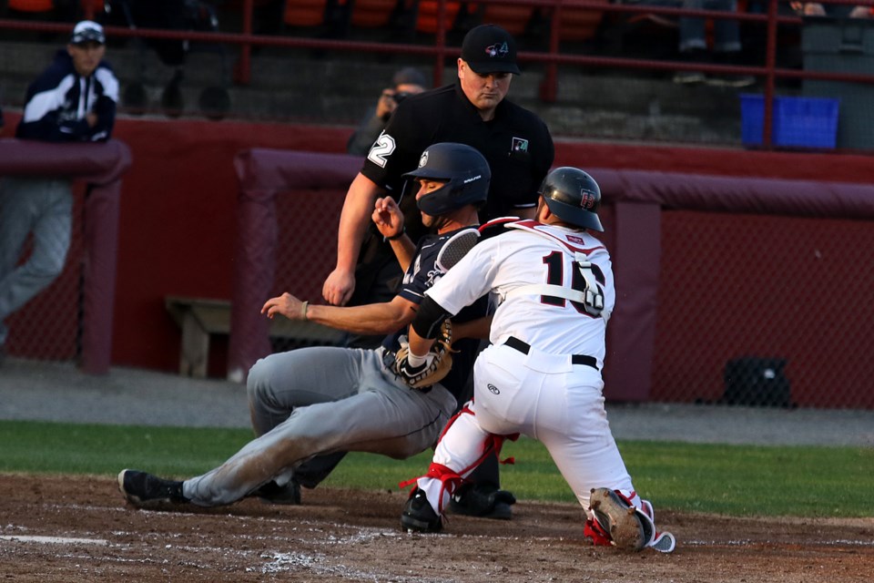 Border Cats catcher Alex Hernandez tags out Duluth's Aaron Greenfield attempting to score on Wednesday, May 29, 2019. (Leith Dunick, tbnewswatch.com)