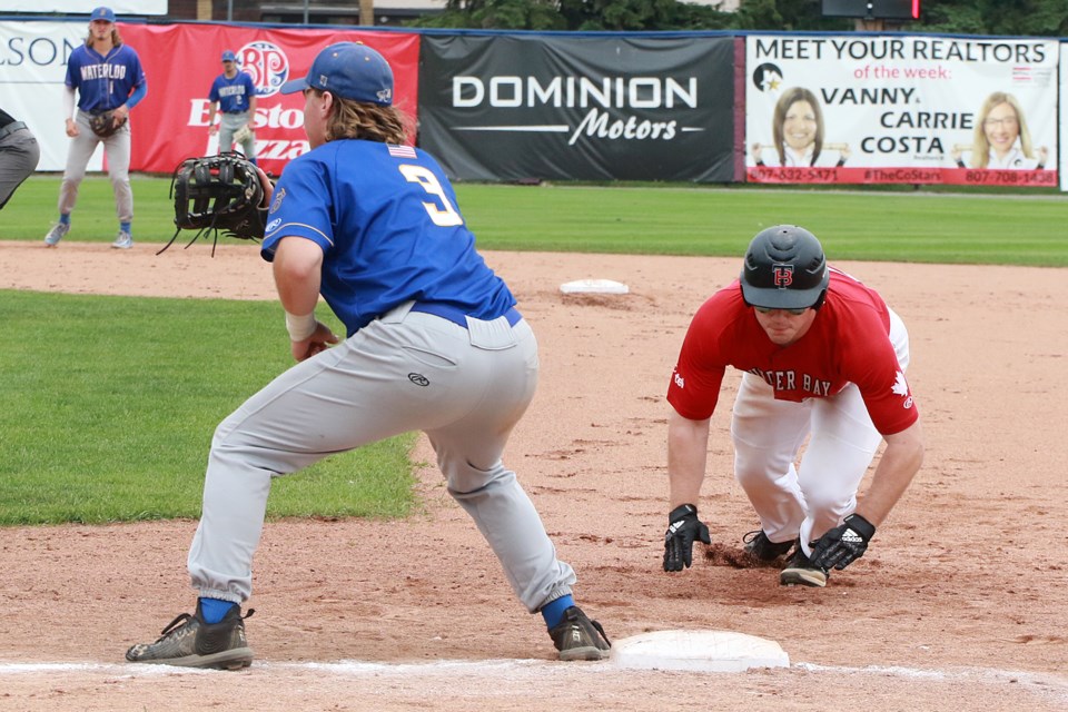 Peter Fusek dives back under the tag of Waterloo 1B Marcus Heusohn on Sunday, Aug. 6, 2023. (Leith Dunick, tbnewswatch.com)