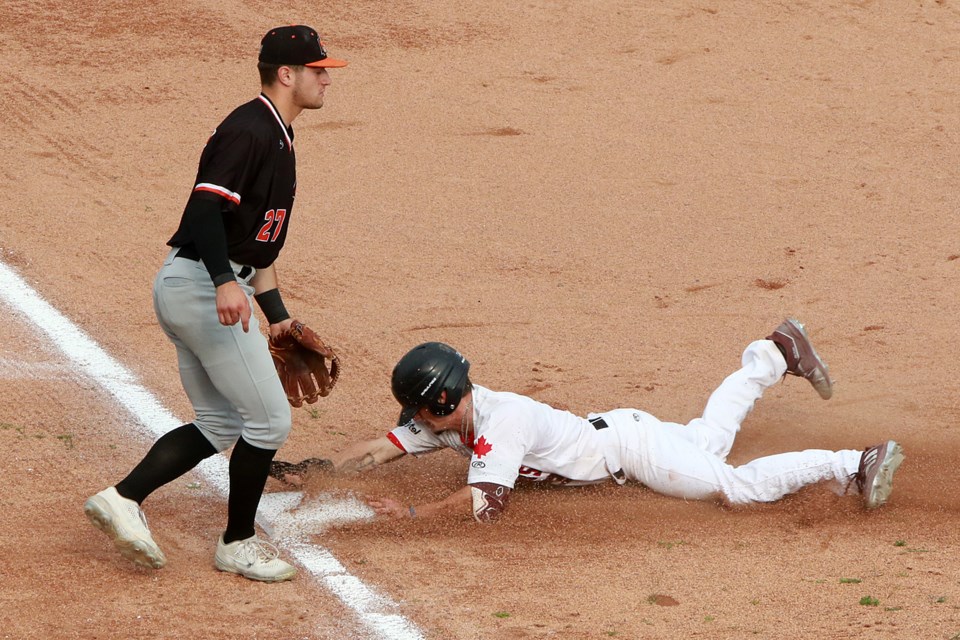 Thunder Bay's Travis Chestnut steals his second of four bases on Saturday, July 15, 2023, giving him a Northwoods League-leading 29 on the season. (Leith Dunick, tbnewswatch.com)