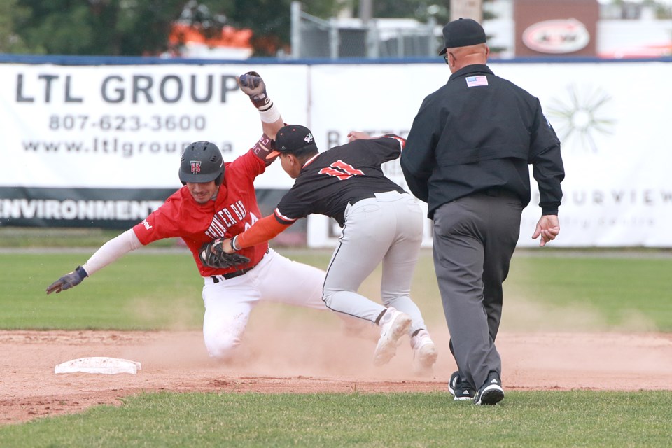 Thunder Bay's Daylan Pena is tagged out by Mankato shortstop Orlando Salinas, Jr., trying to stretch an RBI single into a double, on Sunday, July 16, 2023 at Port Arthur Stadium. (Leith Dunick, tbnewswatch.com)