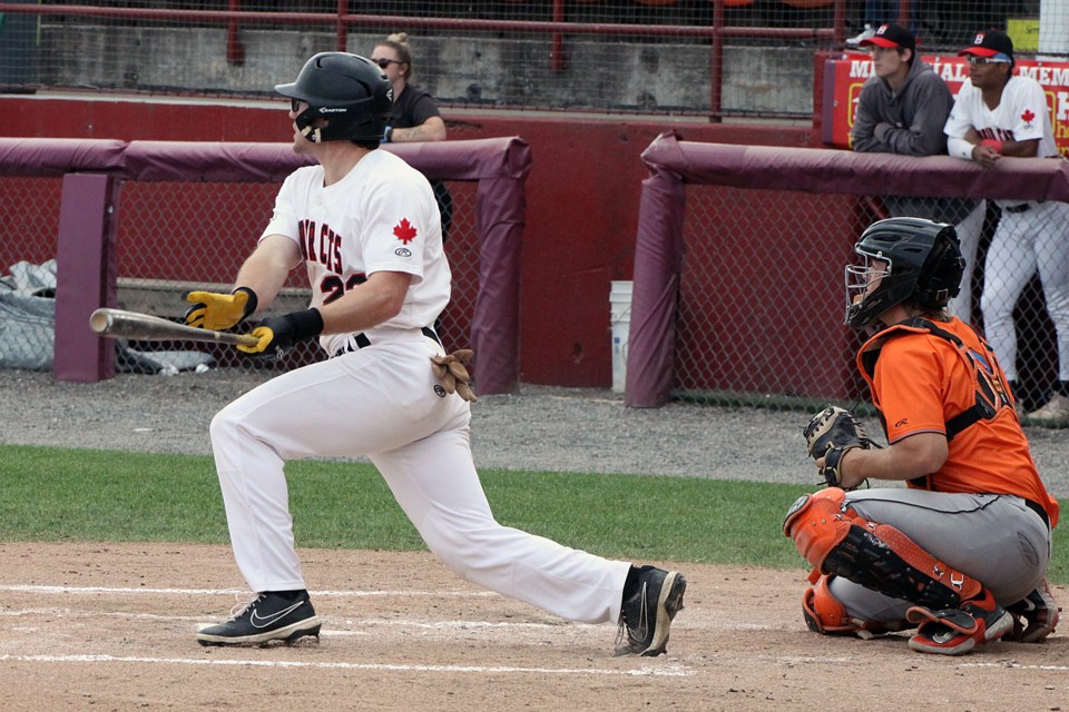 Peter Fusek takes a cut on Thursday, Aug. 8, 2024 against the Eau Claire Express.  (Leith Dunick, tbnewswatch.com)