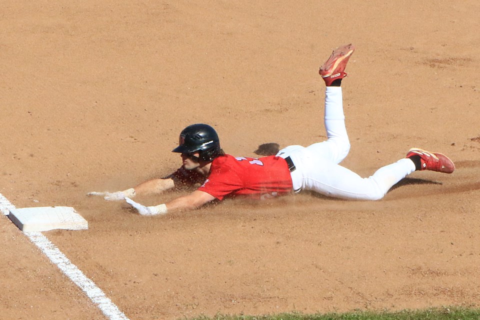 Thunder Bay's Ty Brooks slide in safely to third on Sunday, June 2, 2024. (Leith Dunick, tbnewswatch.)