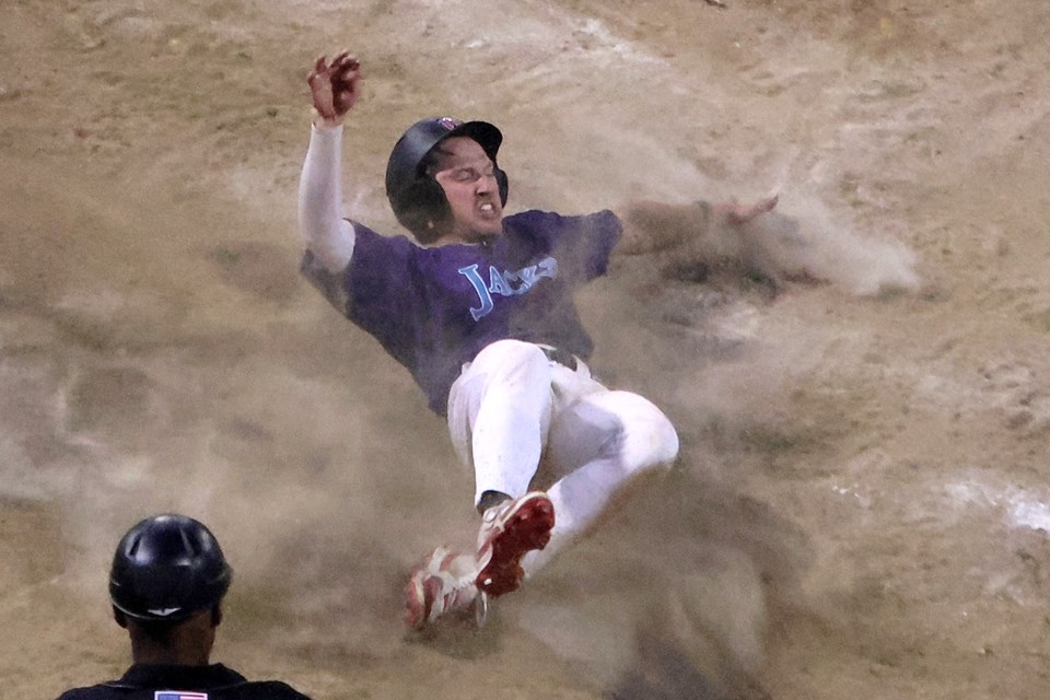 Caleb Watkins slides safely into second, wearing a replica Thunder Bay WhiskeyJacks uniform, with the game-tying run in the ninth inning againt the Duluth Huskies on Wednesday, July 30, 2025 at Port Arthur Stadium. (Leith Dunick, tbnewswatch.com)